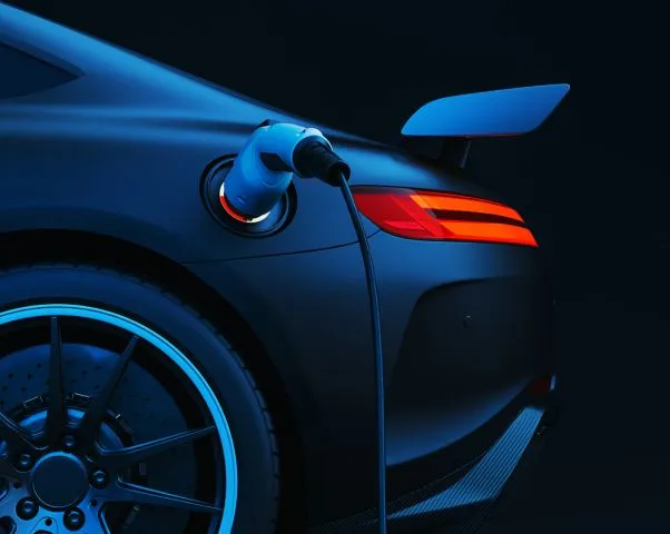 EV charging cable plugged into a car